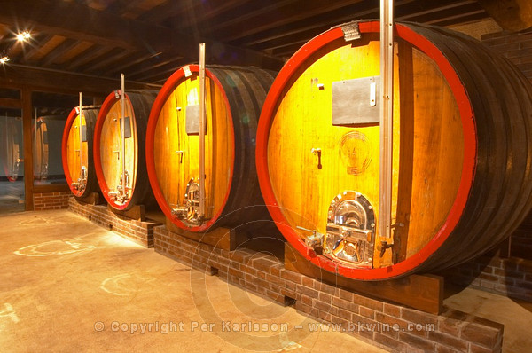In the wine cellar: large oak storage casks, Champagne Jacquesson in Dizy
