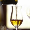 A glass of wine filled with Moscato de Pantelleria in a restaurant on Sicily, Italy
